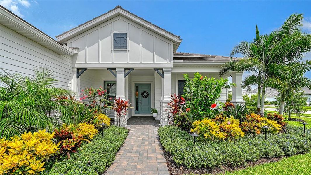 Front exterior of a new home in Windward, Lakewood Ranch, FL, highlighting curb appeal (Image 2). Front exterior of a new home in Windward, Lakewood Ranch, FL, highlighting curb appeal (Image 2).