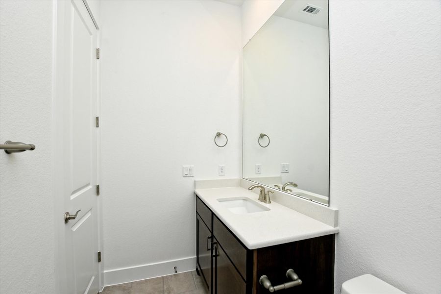 Furnished interior view inside a new home in The Hollows, Jonestown (Image 18).