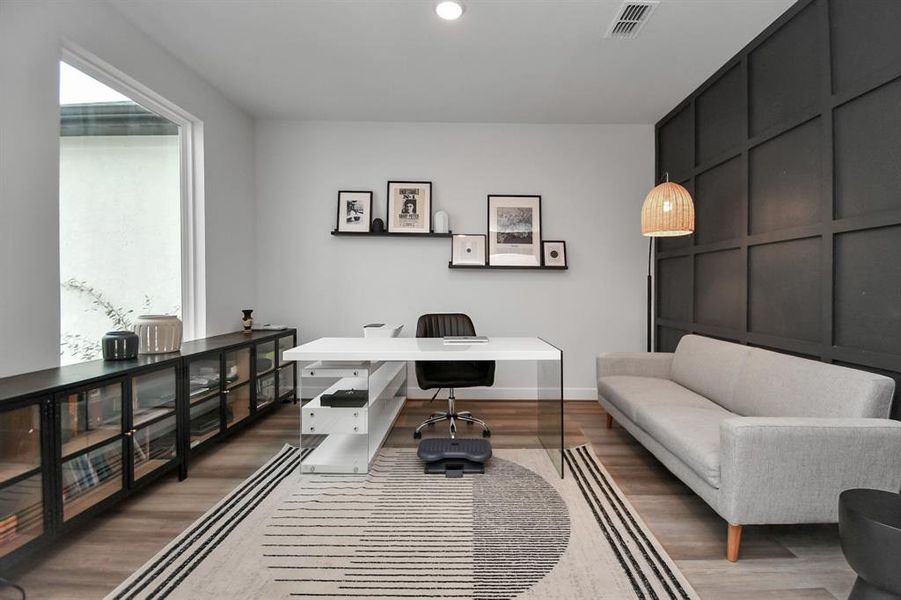 This charming study, bathed with lots of natural light and featuring beautiful flooring and wall.