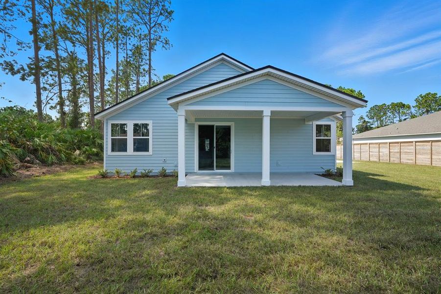 Exterior details and patio area of a home in Palm Coast Homes, Palm Coast (Image 25).