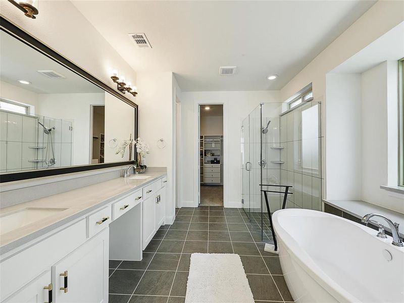 Extended double vanity with dual sinks. Walk-in Closet