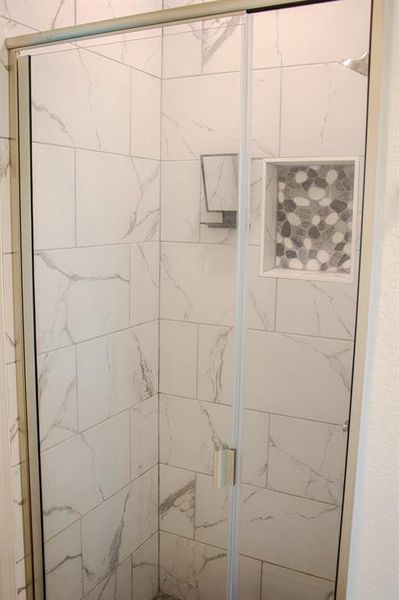 Bathroom with a marble finish shower Bathroom with a marble finish shower