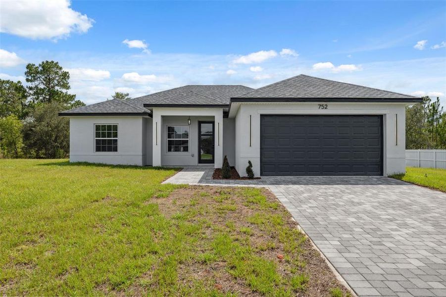 Front exterior of a new home in , Ocala, FL, highlighting curb appeal (Image 28).