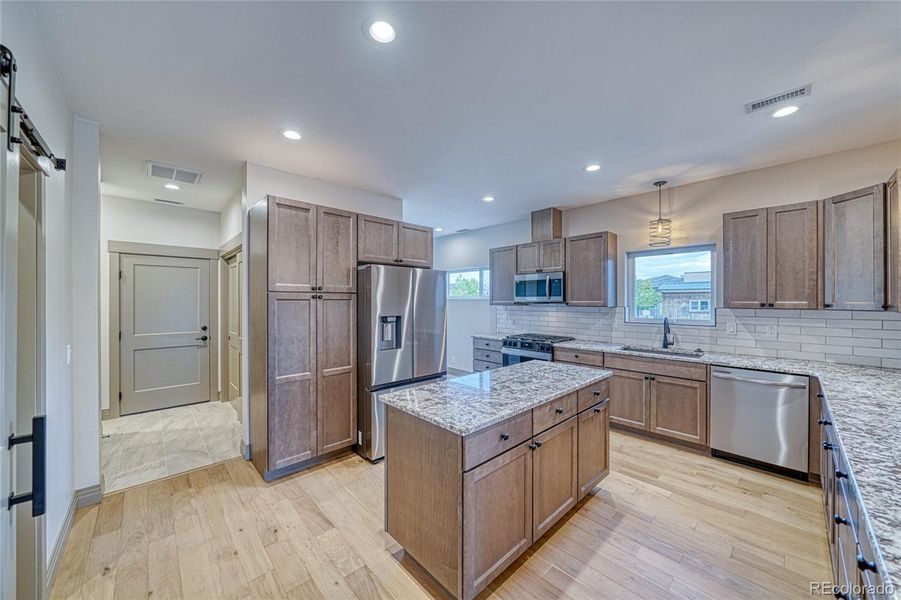 Truly a must see and feel kitchen, with pull out drawers behind the pantry for ease.