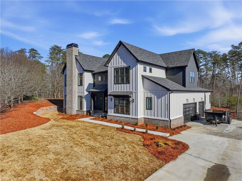 Front exterior of a new home in , Gainesville, GA, highlighting curb appeal (Image 26).
