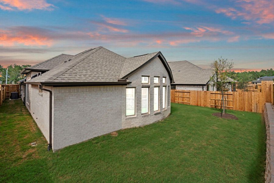 Exterior details and patio area of a home in Wildtree, Magnolia (Image 4).