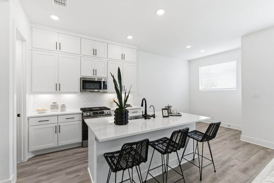 Representative furnished interior of a home built from the Balder by Chesmar Homes in Centero at Stone Oak, San Antonio (Image 6).