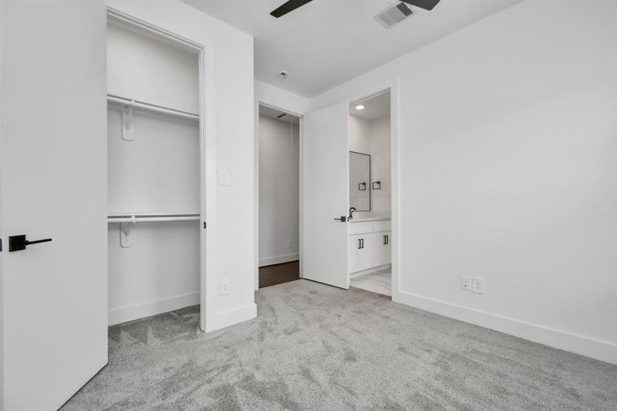 This secondary bedroom is complete with a walk-in closet, and adjoining Jack and Jill bathroom.