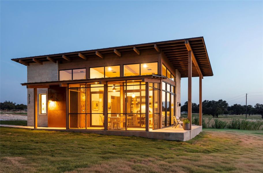 Contemporary exterior elevation featuring expansive windows, screened patio space, and clean modern ranch architecture. Contemporary exterior elevation featuring expansive windows, screened patio space, and clean modern ranch architecture.