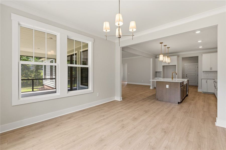 Natural light floods this inviting space, connecti