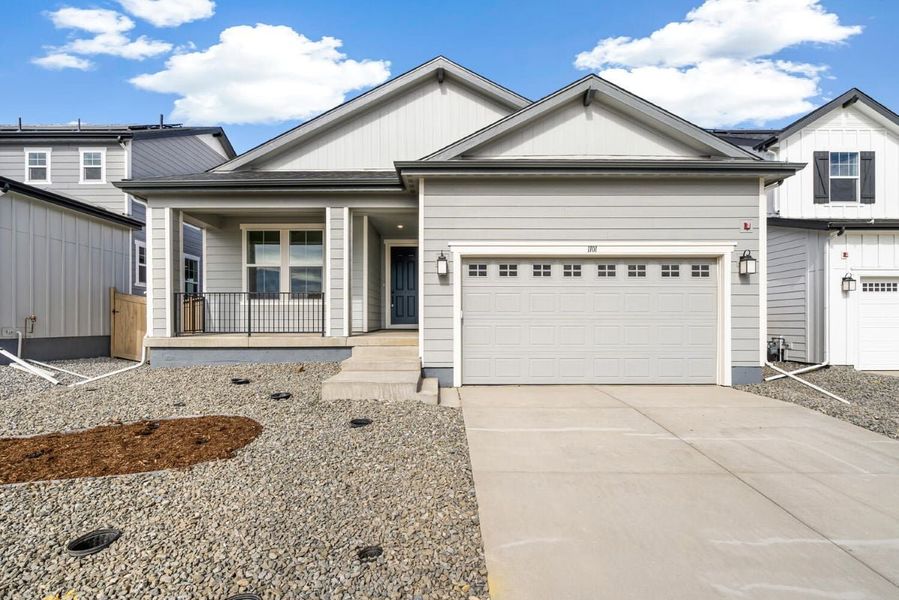 Front exterior of a new home in The Nest Reserve at Canyon Creek, Erie, CO, highlighting curb appeal (Image 1). Front exterior of a new home in The Nest Reserve at Canyon Creek, Erie, CO, highlighting curb appeal (Image 1).