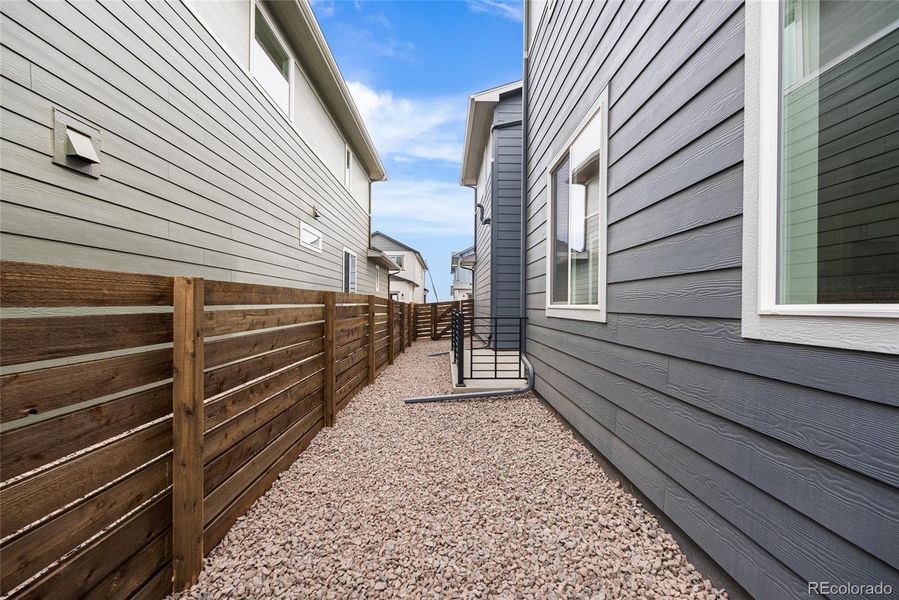 Exterior details and patio area of a home in Barefoot Village, Firestone (Image 24).