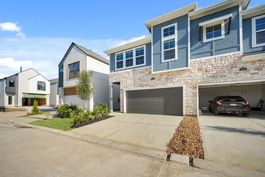 Front exterior of a new home in Piccolina, Houston, TX, highlighting curb appeal (Image 1).