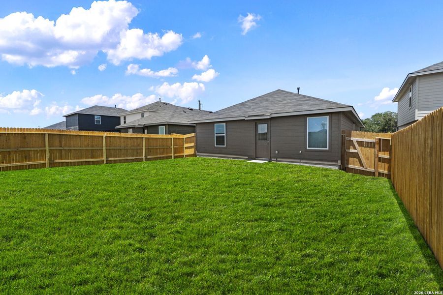 Exterior details and patio area of a home in Hickory Ridge, Elmendorf (Image 2).