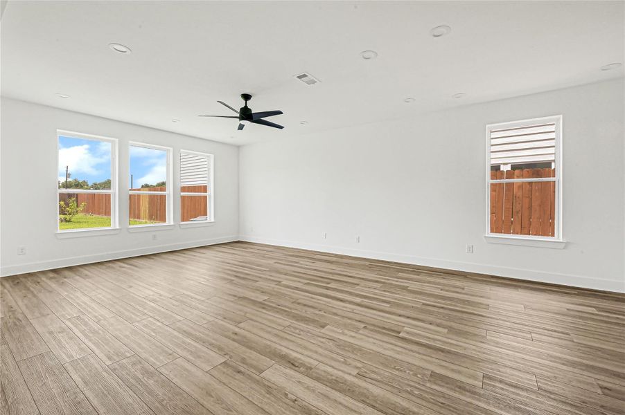 Spacious gathering area with luxury vinyl flooring and open design. Spacious gathering area with luxury vinyl flooring and open design.