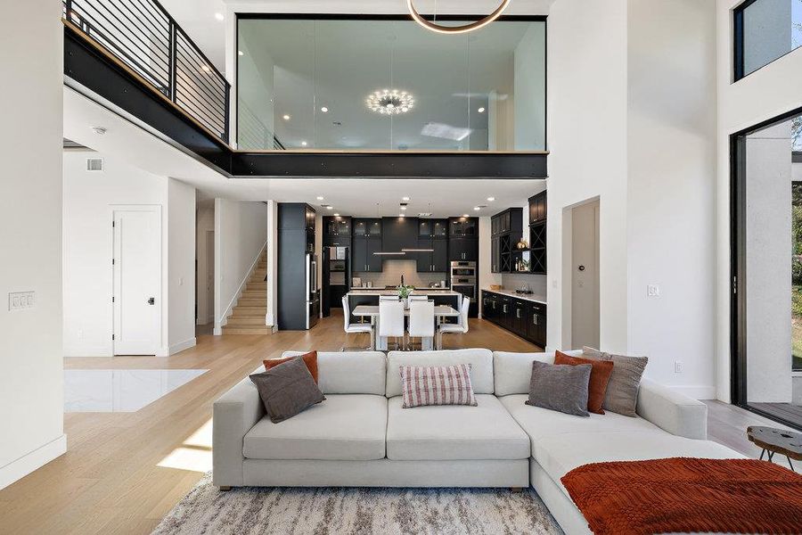 A glass wall off the second floor game room that also overlooks the main level.