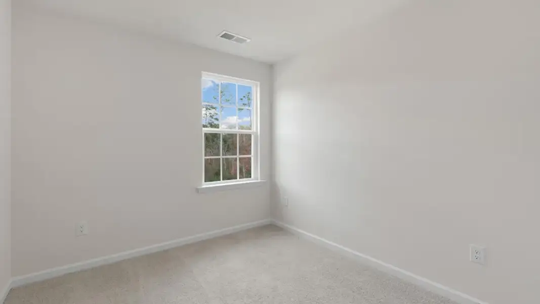 Spacious, unfurnished interior of a new home in The Townes at Galvins Ridge, Sanford (Image 21).
