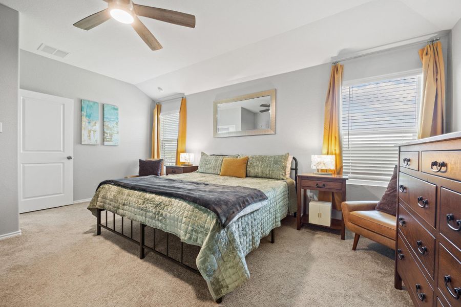 Comfortable main bedroom with high ceilings and warm natural light. Comfortable main bedroom with high ceilings and warm natural light.