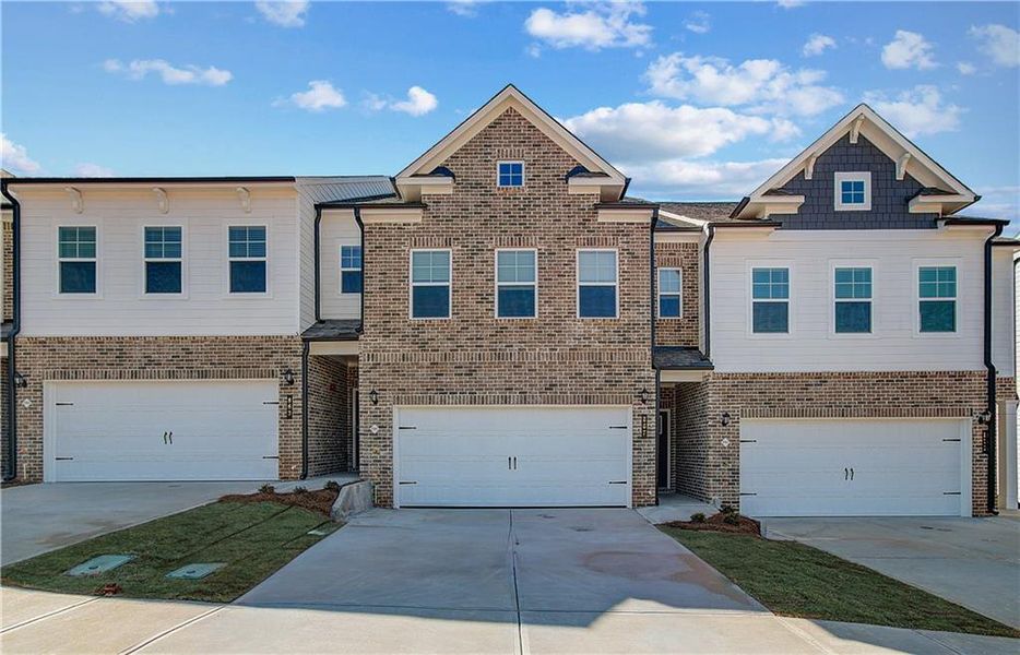 Front exterior of a new home in Auburn Ridge, Riverdale, GA, highlighting curb appeal (Image 24). Front exterior of a new home in Auburn Ridge, Riverdale, GA, highlighting curb appeal (Image 24).