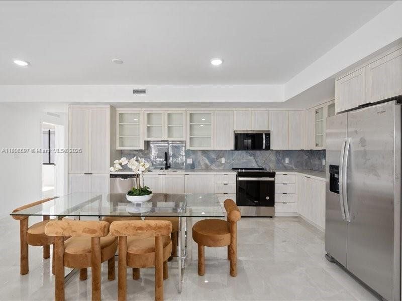 Furnished interior view inside a new home in On Grandville, Homestead (Image 10).