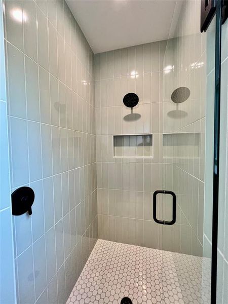 Bathroom with a shower with door