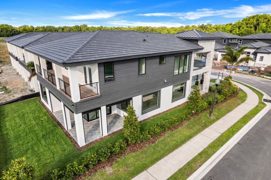 Exterior details and patio area of a home in Hampton Green at Providence, Davenport (Image 3).