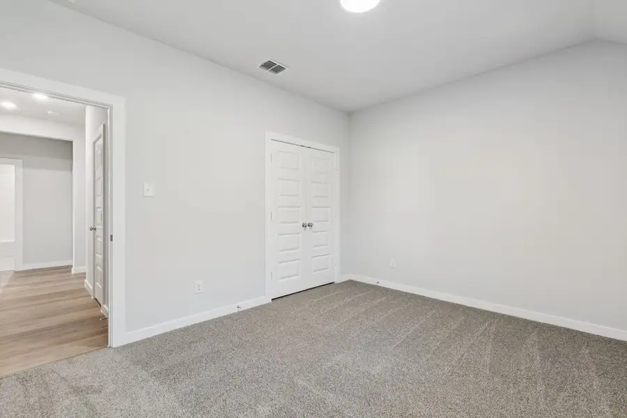 Bedroom in the Oscar home plan by Trophy Signature Homes – REPRESENTATIVE PHOTO Bedroom in the Oscar home plan by Trophy Signature Homes – REPRESENTATIVE PHOTO