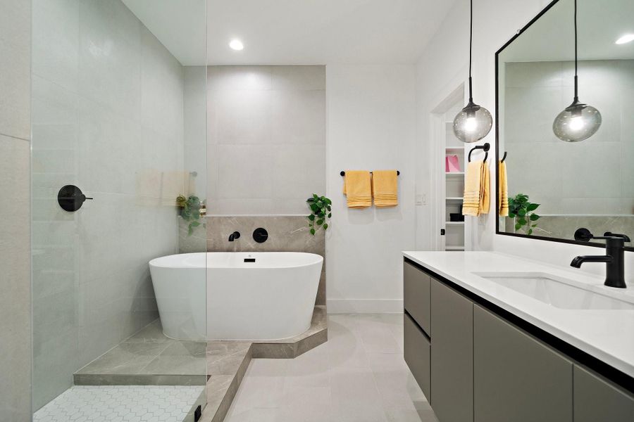 This modern vanity features a sleek, double-sink design with ample space for two. Clean lines and high-end finishes create a stylish, functional space, perfect for sharing while maintaining a clutter-free, organized look.
