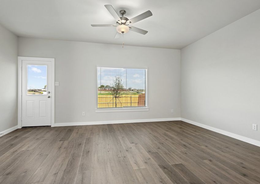 The living room has a large window that lets in great, natural light.