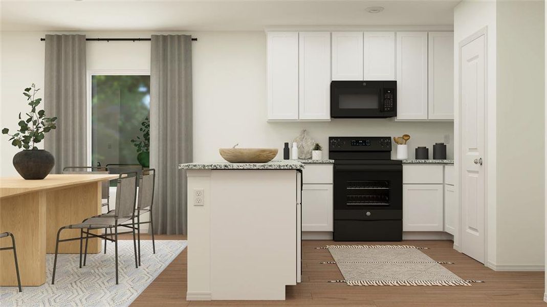 Kitchen with white cabinets, light wood-type flooring, light stone countertops, and black appliances