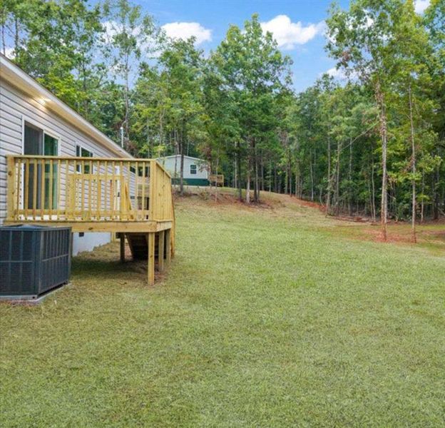Front exterior of a new home in , Eatonton, GA, highlighting curb appeal (Image 23).