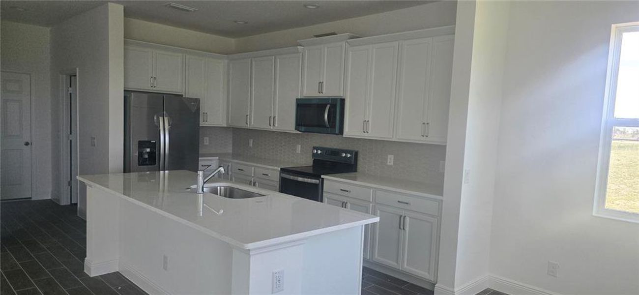 Furnished interior view inside a new home in Ridgeview, Clermont (Image 4).