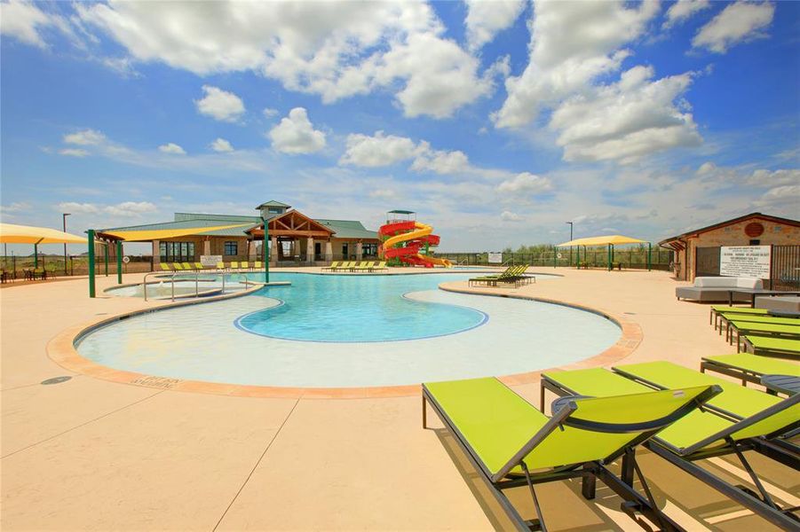 View of swimming pool featuring a patio area and a water slide