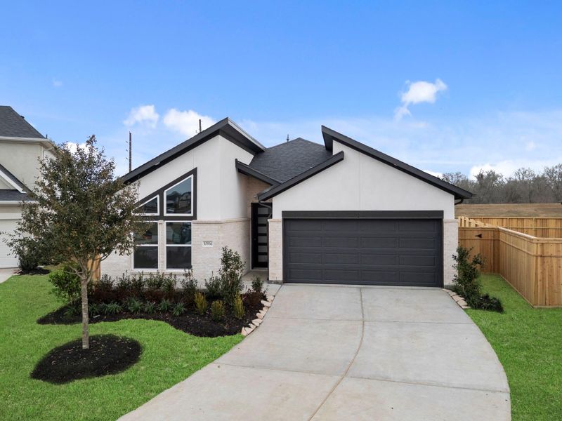 Front exterior of a new home in Sienna 45', 50', Missouri City, TX, highlighting curb appeal (Image 23).