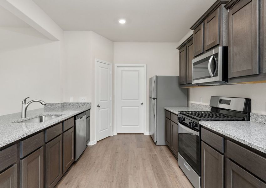 The kitchen of the Cypress has gorgeous wood cabinetry. The kitchen of the Cypress has gorgeous wood cabinetry.
