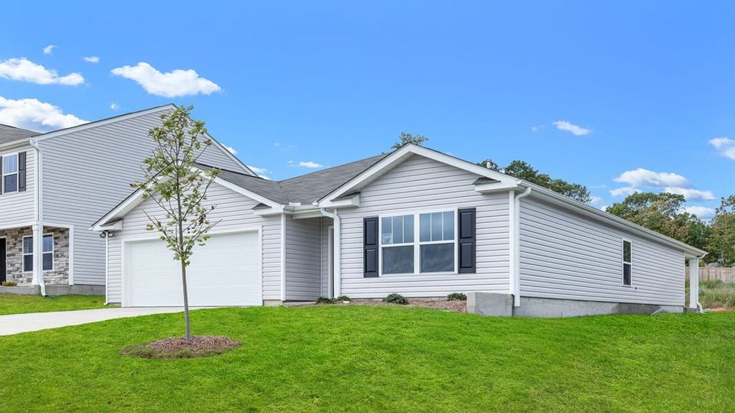 Front exterior of a new home in Ravencrest, Roebuck, SC, highlighting curb appeal (Image 2). Front exterior of a new home in Ravencrest, Roebuck, SC, highlighting curb appeal (Image 2).
