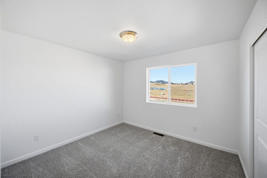 Spacious, unfurnished interior of a new home in Trailstone Town Collection, Arvada (Image 29).