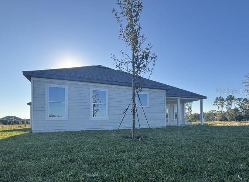 Exterior details and patio area of a home in Ardisia Park Estate, New Smyrna Beach (Image 29).
