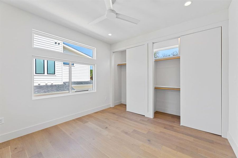 Primary bedroom with double closets.