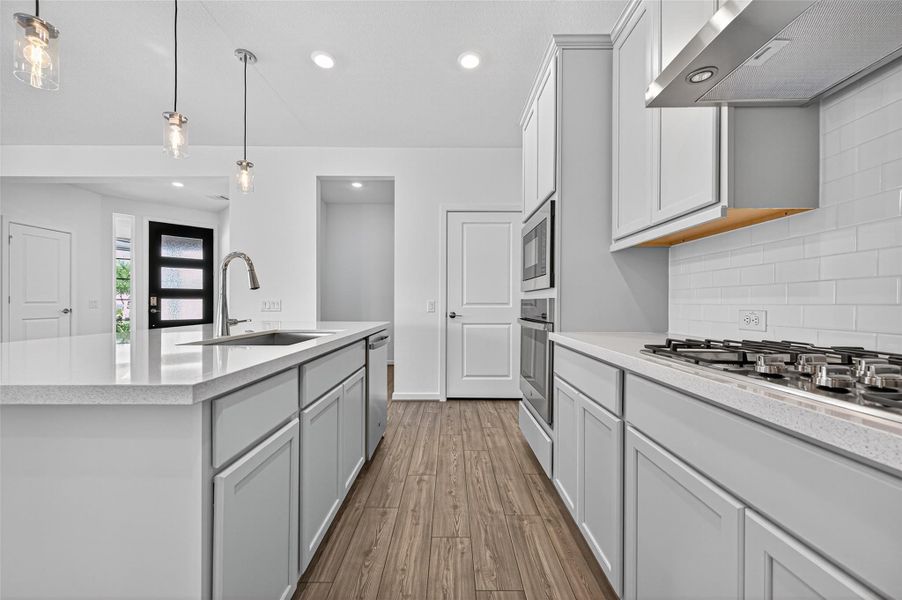 Thoughtfully designed with a large working space, abundant counter island, and easy access to appliances, making it both functional and ideal for entertaining.