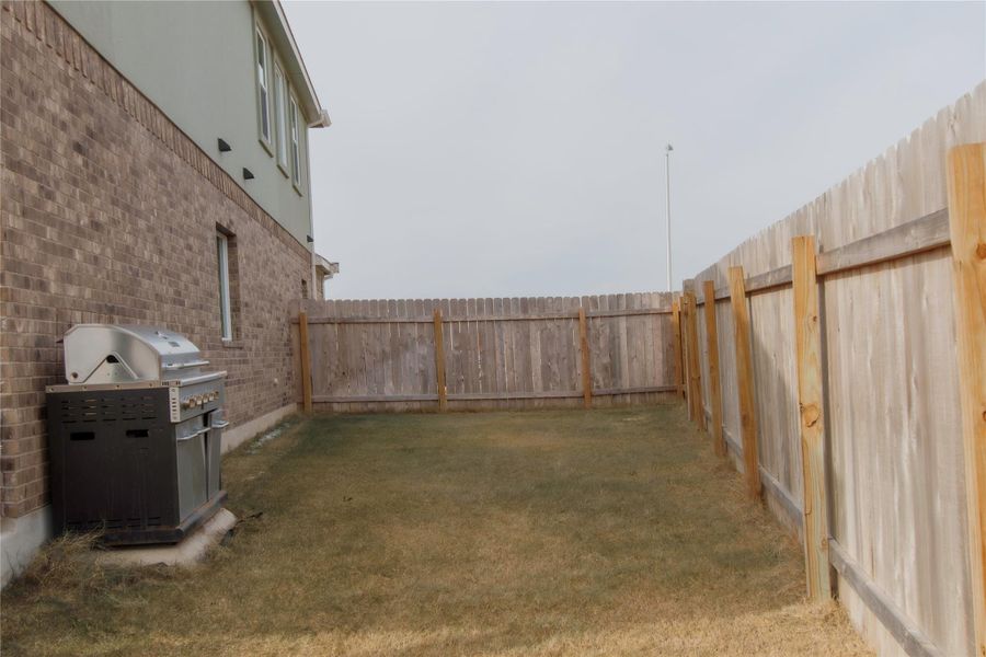 View of fenced backyard