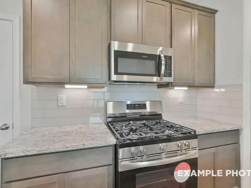 Furnished interior view inside a new home in Caney Creek Place, Conroe (Image 9).