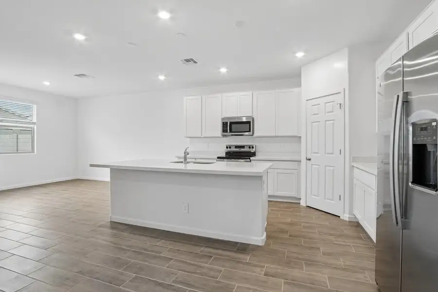 Kitchen featuring the Essentials finishes. Representative images and renderings are for illustrative purposes. Actual structural options and design finishes of home may vary. Kitchen featuring the Essentials finishes. Representative images and renderings are for illustrative purposes. Actual structural options and design finishes of home may vary.