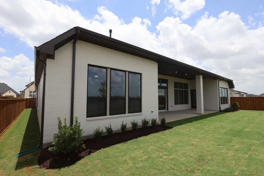 Exterior details and patio area of a home in Dunham Pointe, Cypress (Image 19). Exterior details and patio area of a home in Dunham Pointe, Cypress (Image 19).