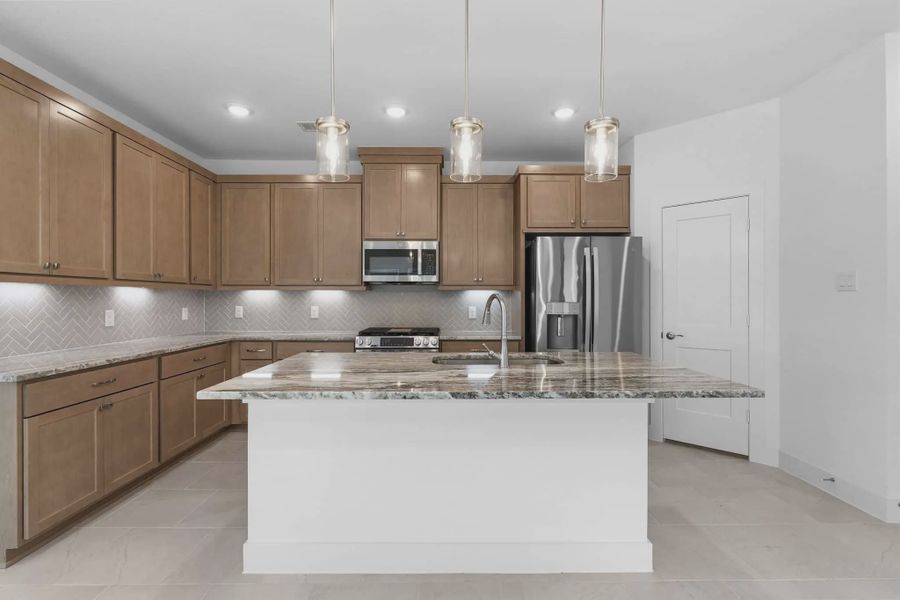 Representative furnished interior of a home built from the Carriagehouse by Chesmar Homes in Meridiana Townhomes, Iowa Colony (Image 11).