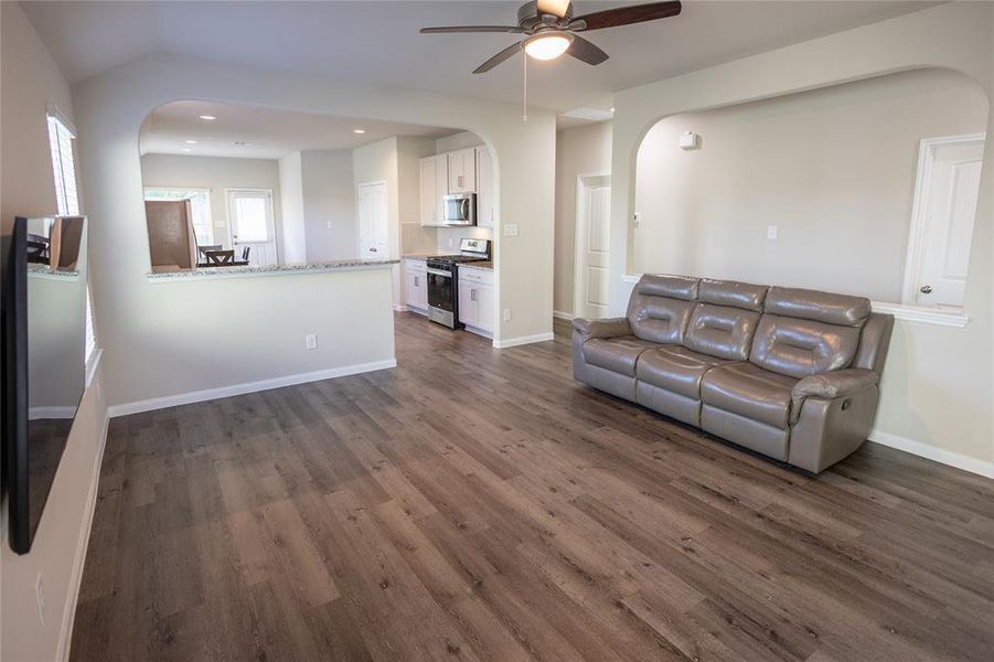 Beautiful vinyl plank flooring and high ceilings that create an immediate wow factor.