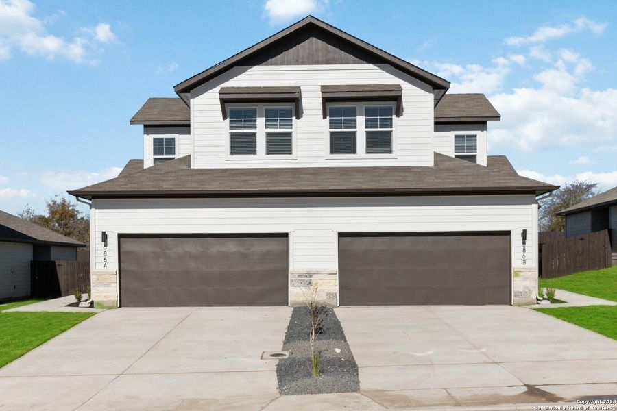Front exterior of a new home in Emma Park, Buda, TX, highlighting curb appeal (Image 24). Front exterior of a new home in Emma Park, Buda, TX, highlighting curb appeal (Image 24).