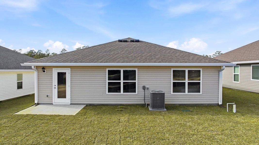 Exterior details and patio area of a home in Magnolia at the Bluffs Phase 3, Freeport (Image 2). Exterior details and patio area of a home in Magnolia at the Bluffs Phase 3, Freeport (Image 2).
