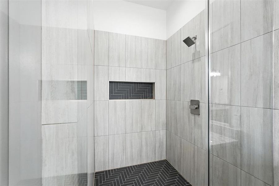 Full bathroom featuring a shower stall Full bathroom featuring a shower stall