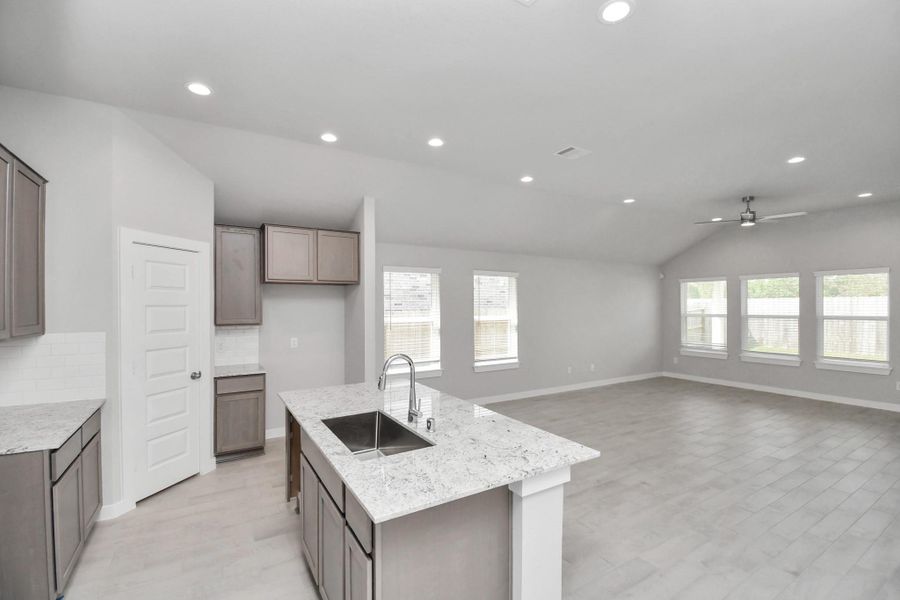 All of this overlooks your expansive family room, creating a perfect space for culinary delights and family gatherings.